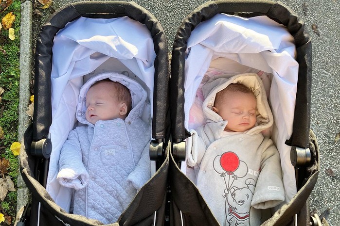 2 pictures of babies in Out n About GT Double carrycots