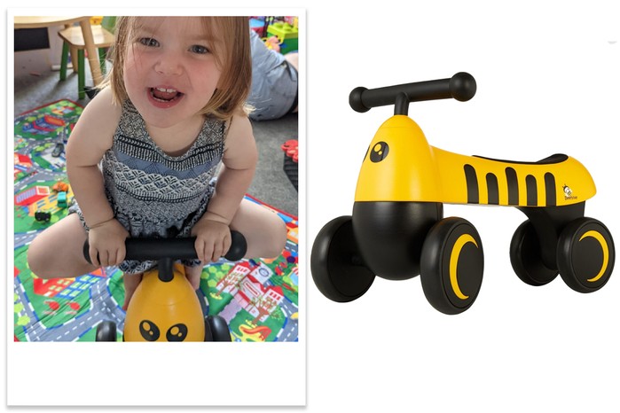 Beehive Toys Bumblebee Ride-on with child tester