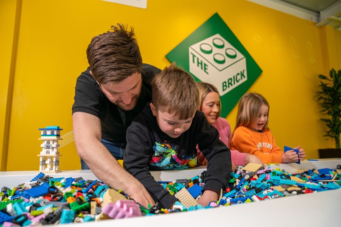 family playing with lego at legoland resort