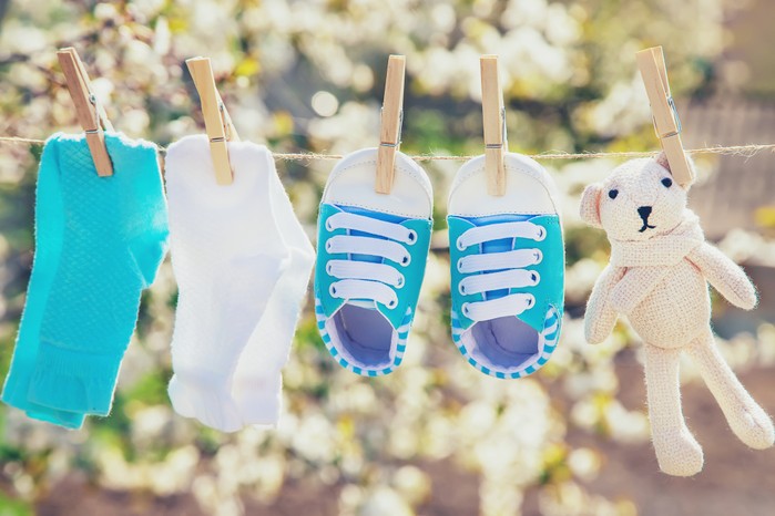 baby socks and shoes on a washing line