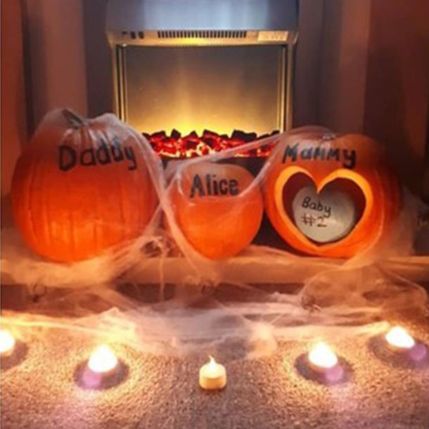 3 pumpkins lined up, named Daddy, Alice and Mummy with a Baby pumpkin inside