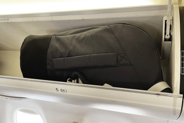 RyRy Scallop car seat in overhead compartment of a plane