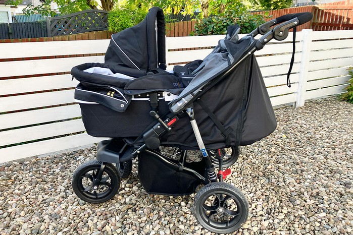 Side view of Out n About GT Double with carrycot hood up