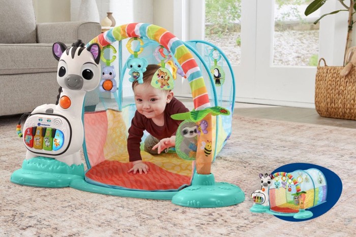 A baby crawling through the 6-in-1 Playtime Tunnel