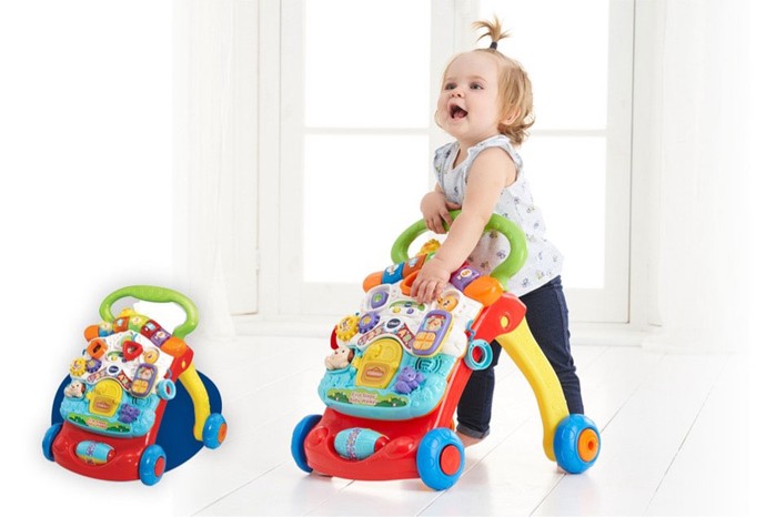A child using the First Steps Baby Walker